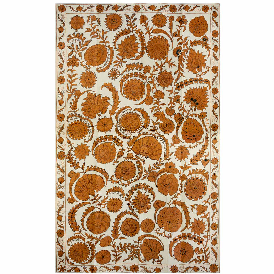 Front view of Mekhann's caramel botanical  throw, revealing how all the botanical design elements come together and form the caramel botanical throw. All caramel coloured embroidery has been done on a canvas of cream coloured silk.
