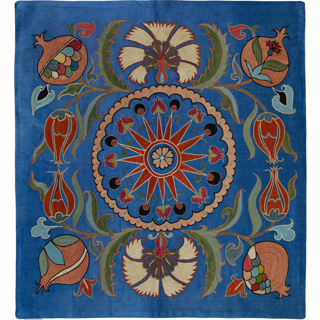Front view of Mekhann's navy botanical petite throw, features a central floral medallion surrounded by an array of pomegranates and botanical motifs against a deep blue silk background.