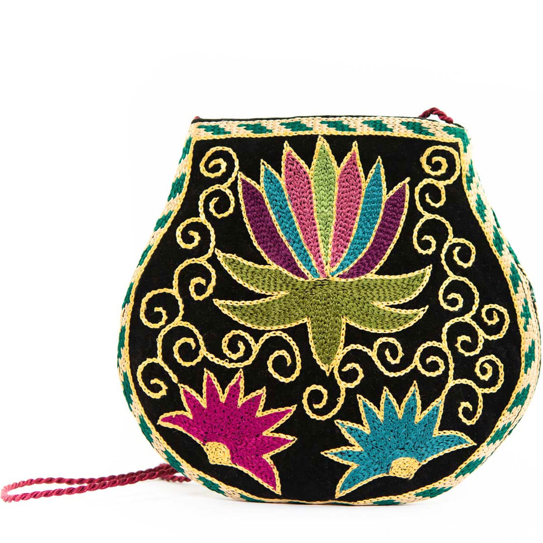 Alternative view of Mekhann's botanical black velvet pouch, showing a different angle of the pouch to better understand the shape and colours of the pouch.