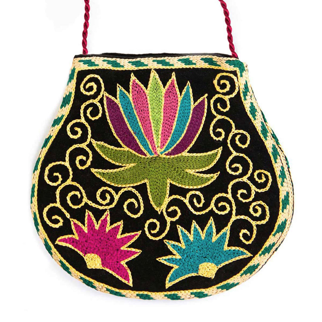Front view of Mekhann's botanical black velvet pouch, displaying three Beautifully colourful flowers in an array of blue, pink, purple, and green.