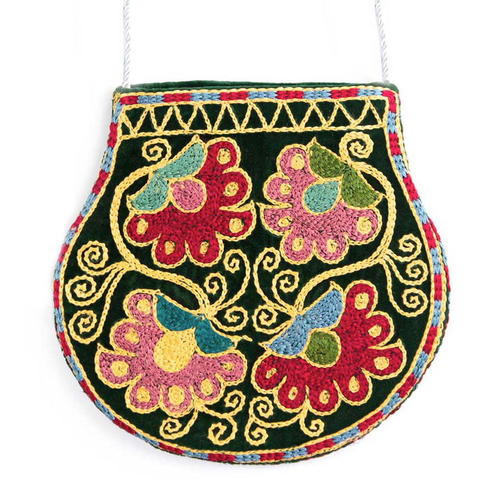 Front view of Mekhann's botanical green velvet pouch, a Beautiful display of four embroidered flowers created in pink and red.