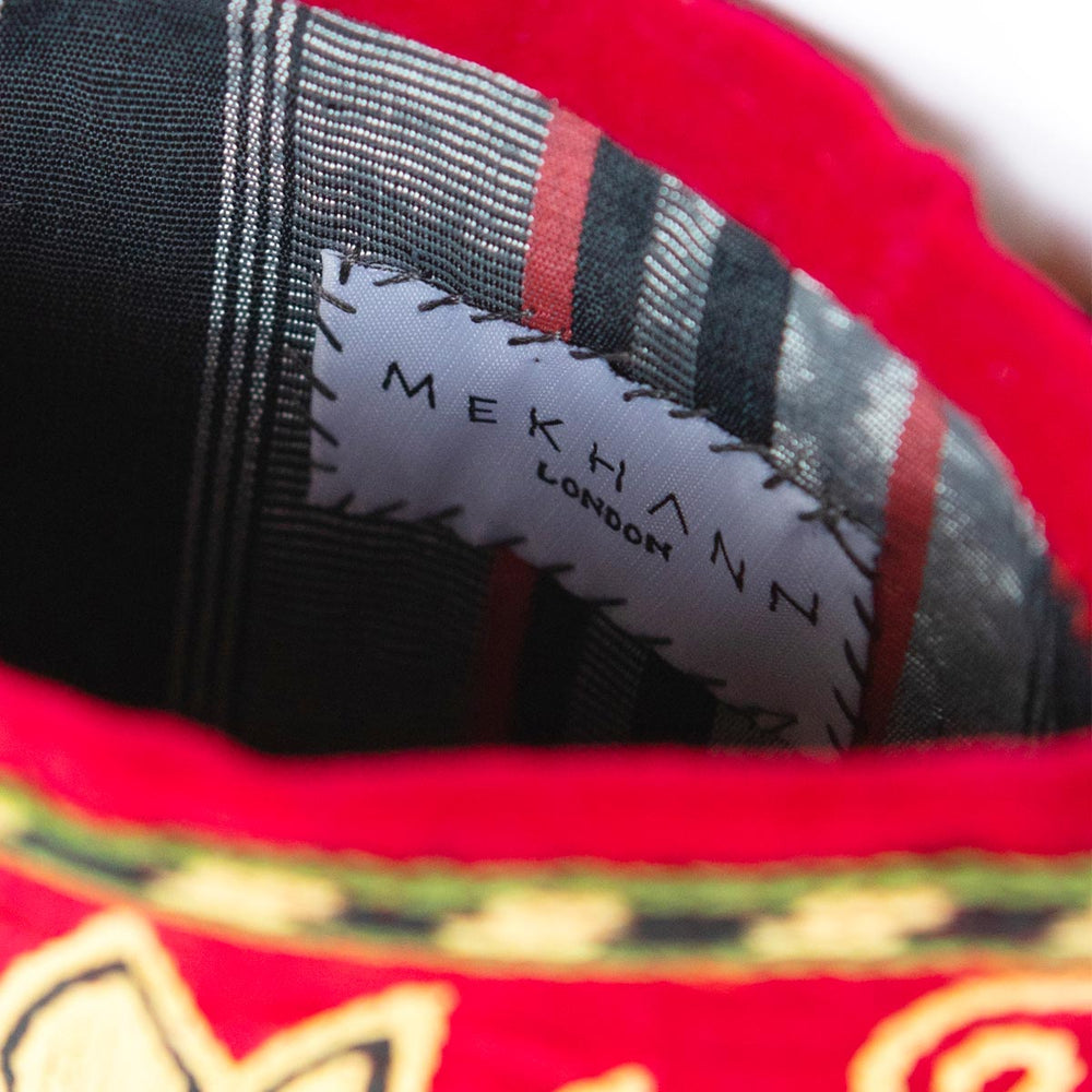 Inside view of Mekhann's botanical light maroon velvet pouch, showcasing the durable living fabric of the pouch.