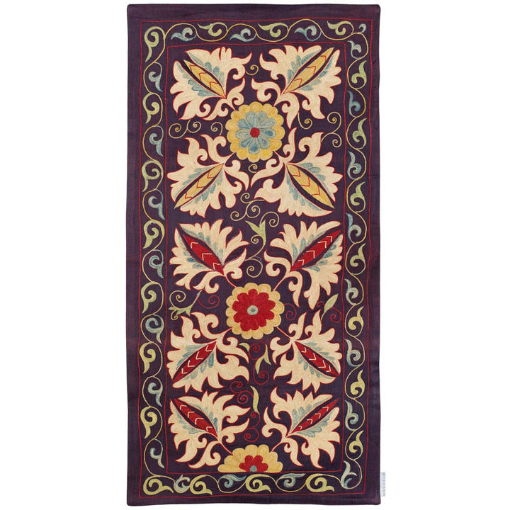Front view of Mekhann's purple botanical runner, featuring Detailed embroidery of Mekhann's purple runner, highlighting the fine craftsmanship of the intricate botanical patterns that have been hand embroidered onto purple silk.