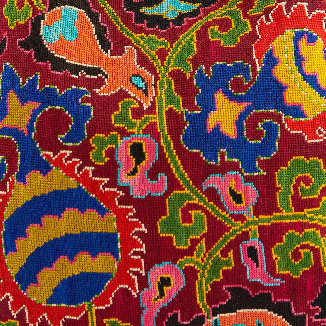 Close-up of the intricate hand embroidery on Mekhann's multicoloured large shoulder bag, highlighting the detailed artisan work.