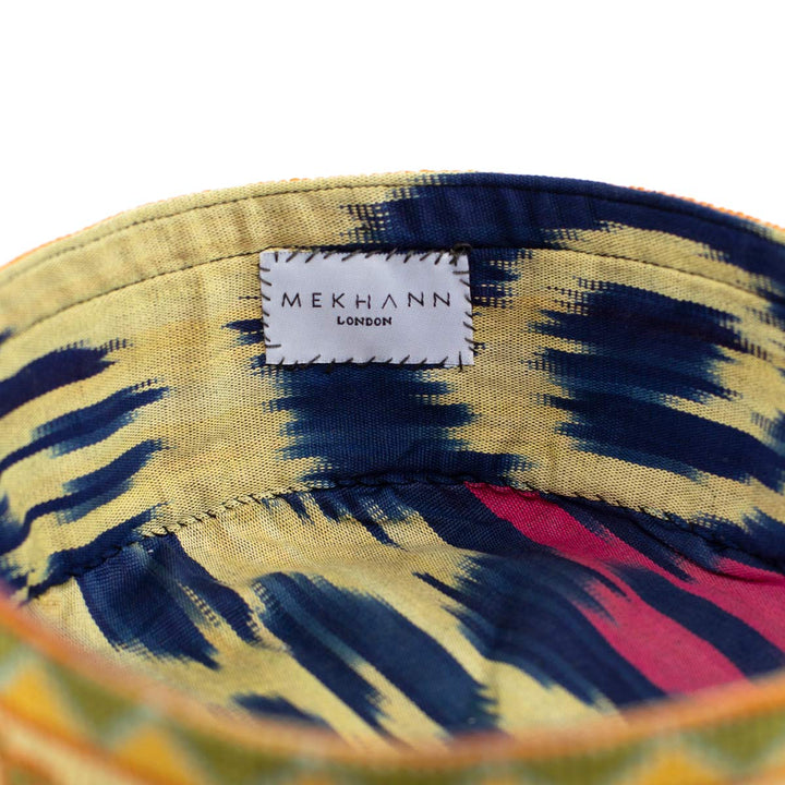 Inside view of Mekhann's botanical cream skull cap, showcasing the ikat lining used for both durability and comfort.