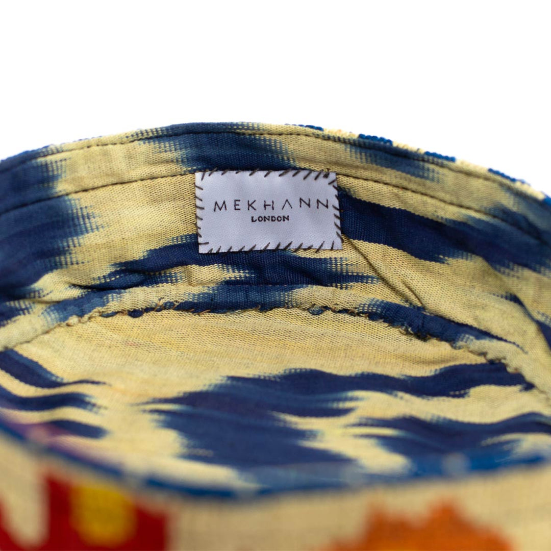 Inside view of Mekhann's botanical  skull cap, revealing the blue and cream ikat lining used for its beauty and durability.