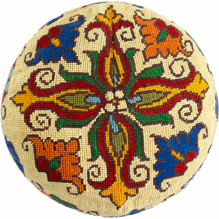 Top view of Mekhann's botanical cream skull cap, showing a wonderful botanical pattern display in bright colours.