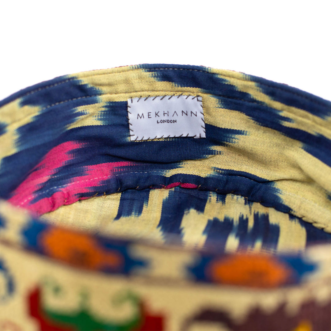 Inside view of Mekhann's botanical cream skull cap, Revealing a wonderful ikat lining used for durability and style.