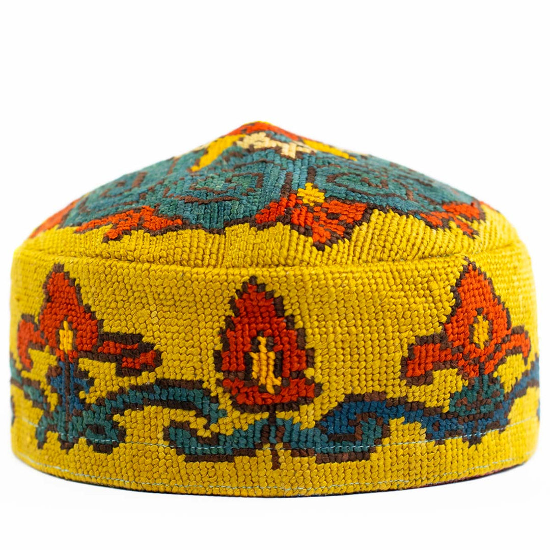 Front view of Mekhann's botanical yellow skull cap, showcaseing the attention to detail in the design and craftsmanship with a bold yellow hand embroidered details..