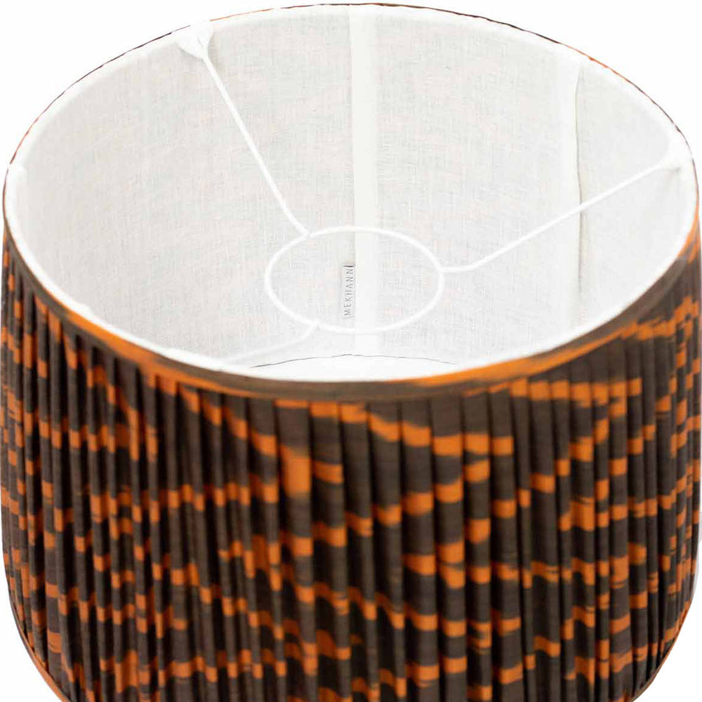 Inside view of Mekhann's brown and orange ikat lampshade, showing off the warm silk fabric and bespoke ikat pattern.
