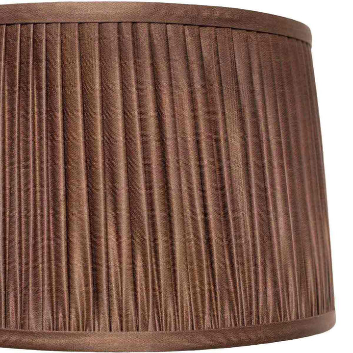 Close-up of Mekhann's brown silk lampshade, showcasing the meticulous hand-pleating technique and rich, sumptuous colour.