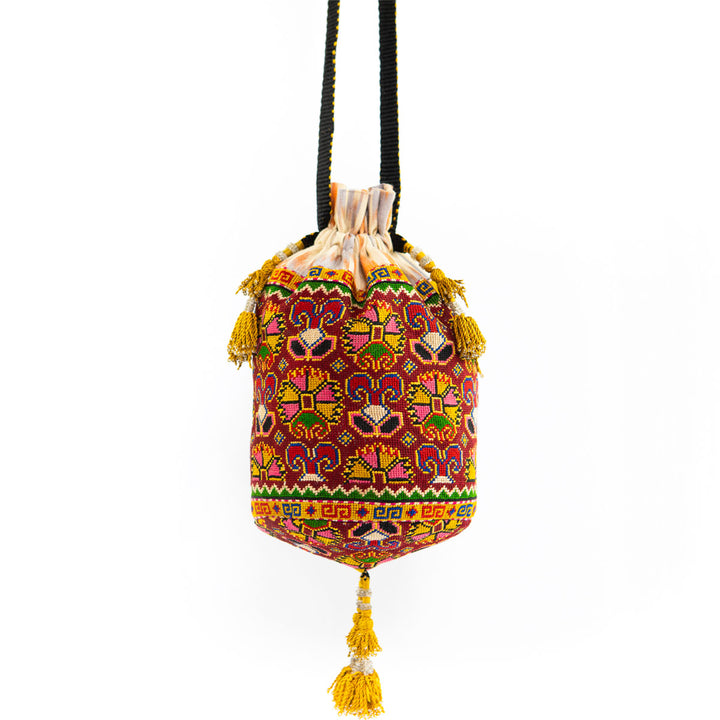 Full front view of Mekhann's multicoloured embroidered carnations bucket bag, showcasing the distinctive shape and ornate design details.