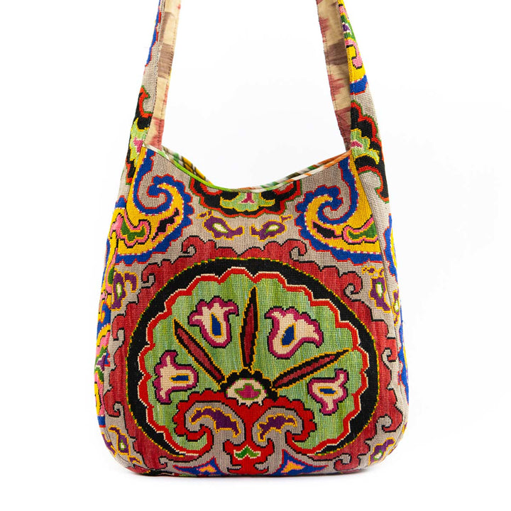 Alternative view of Mekhann's carnations multicoloured shoulder bag, displaying the bag's unique shape and patterned design.