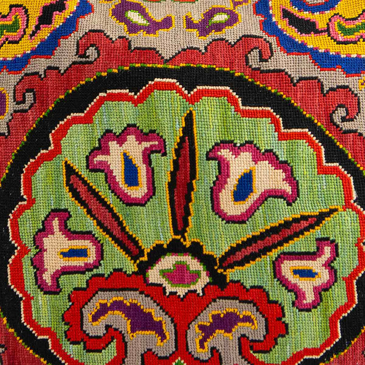 Close-up of the intricate embroidery on Mekhann's multicoloured carnations shoulder bag, focusing on the rich textures and colour depth