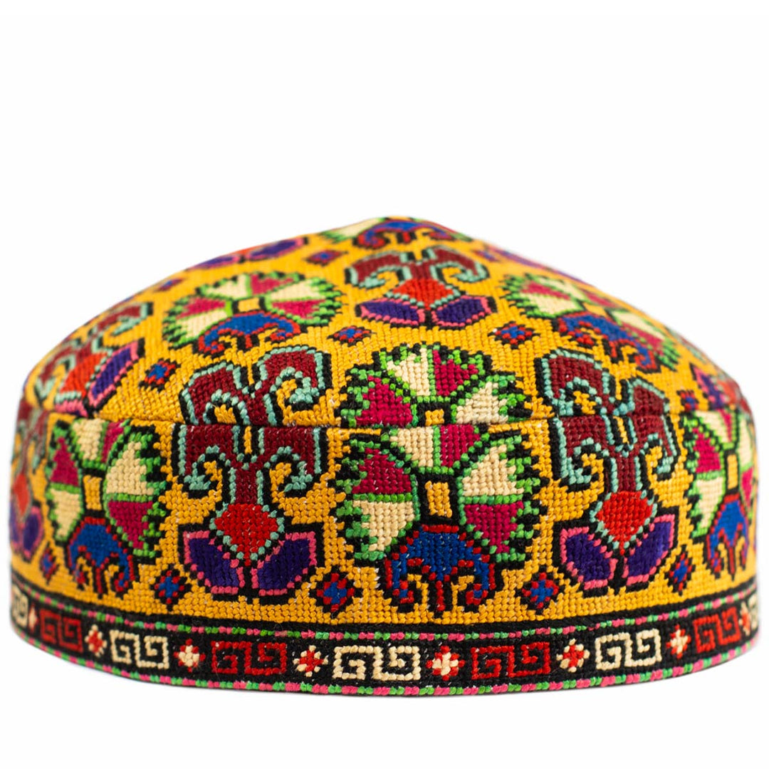 Front view of Mekhann's yellow carnations  skull cap, showcasing an array of colour hand embroidered carnation patterns.