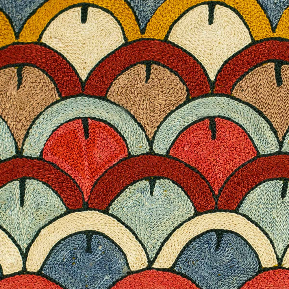 Close up view of Mekhann's Yellow Domes silk fully embroidered cushion, highlighting the rich texture and colour variation in the dome pattern of Mekhann's yellow embroidered cushion.