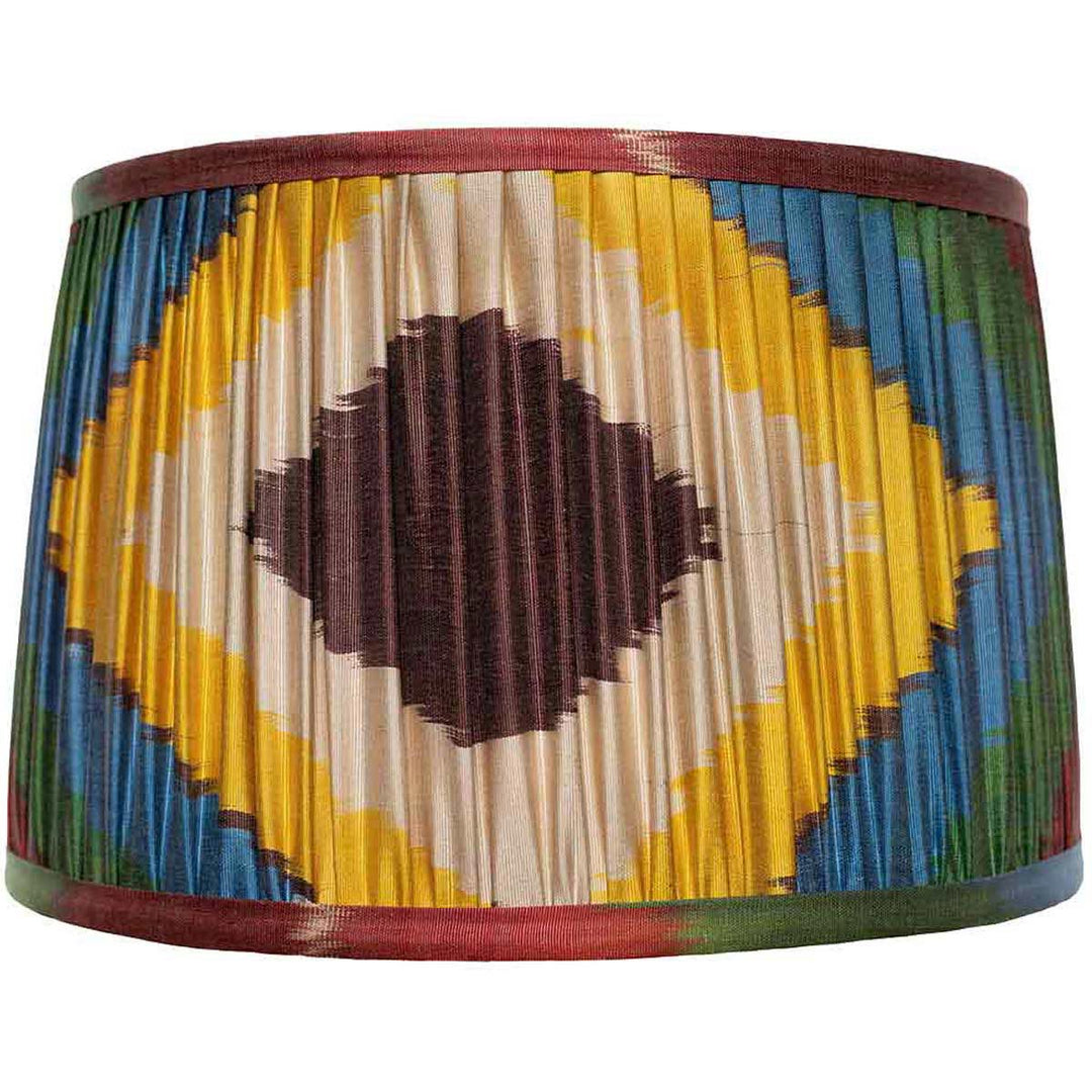 Front view of Mekhann's colourful silk ikat lampshade with a bold diamond pattern, hand-pleated with natural dyes.