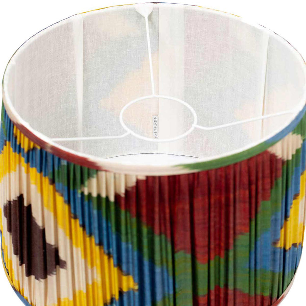Inside look at Mekhann's vibrant ikat lampshade, revealing the exquisite hand-pleating and vivid colour play