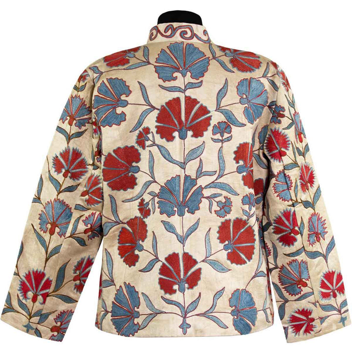 Back view of Mekhann's embroidered carnations jacket in cream, showing how the blue and red carnation motifs spread to the back area of the jacket.