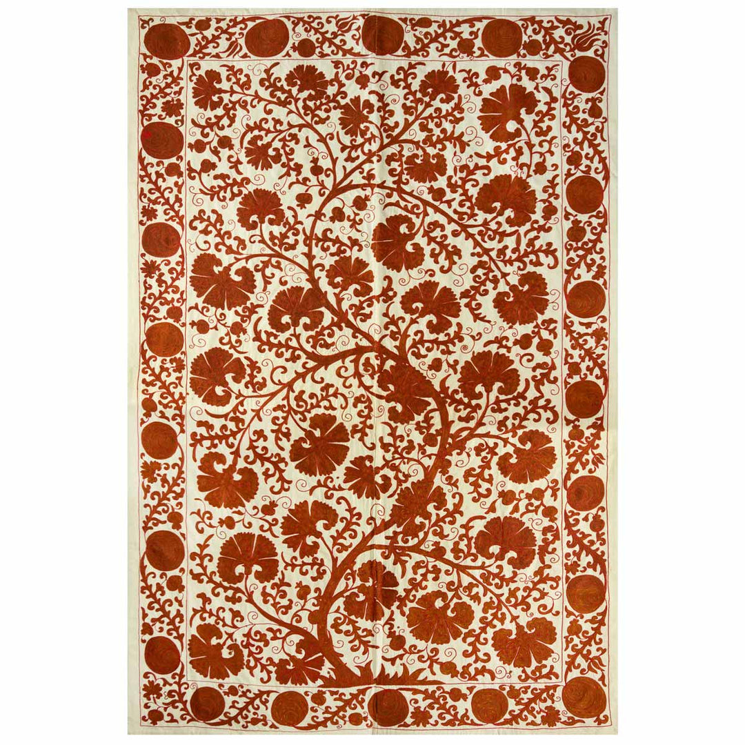 Front view of Mekhann's cream carnations throw, with a full display of warm orange toned carnation motifs on a base of cream silk.