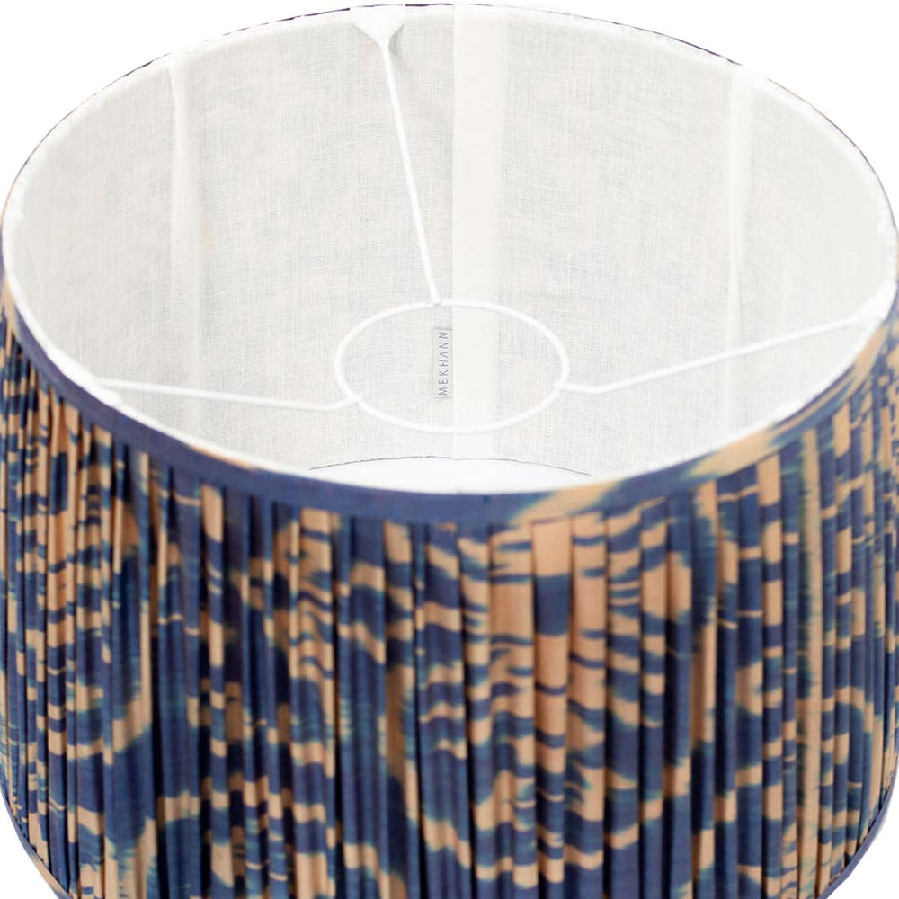 nterior perspective of Mekhann's navy silk lampshade, highlighting the sophisticated cream ikat pattern and premium silk texture.