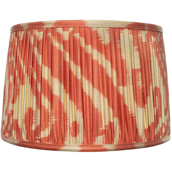 Front view of Mekhann's cream and orange ikat silk lampshade, hand-pleated with natural dyes for a warm, inviting look.