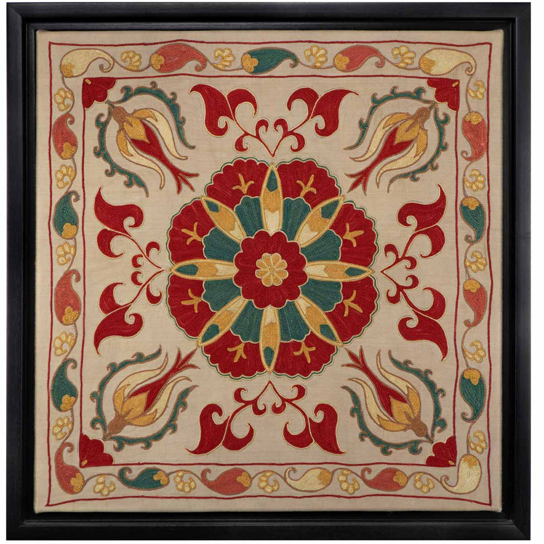 Front view of Mekhann's cream silk botanicals artwork, displaying a cream canvas adorned with a symmetrical arrangement of colourful botanical embroidered designs, all within its black frame.