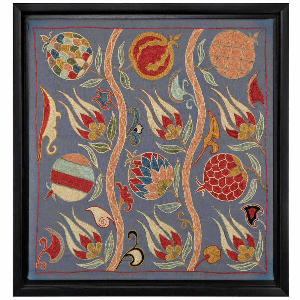 Front view of Mekhann's grey silk botanicals artwork, where navy blue silk canvas serves as a backdrop for vines, leaves, and fruit designs in vibrant colours.