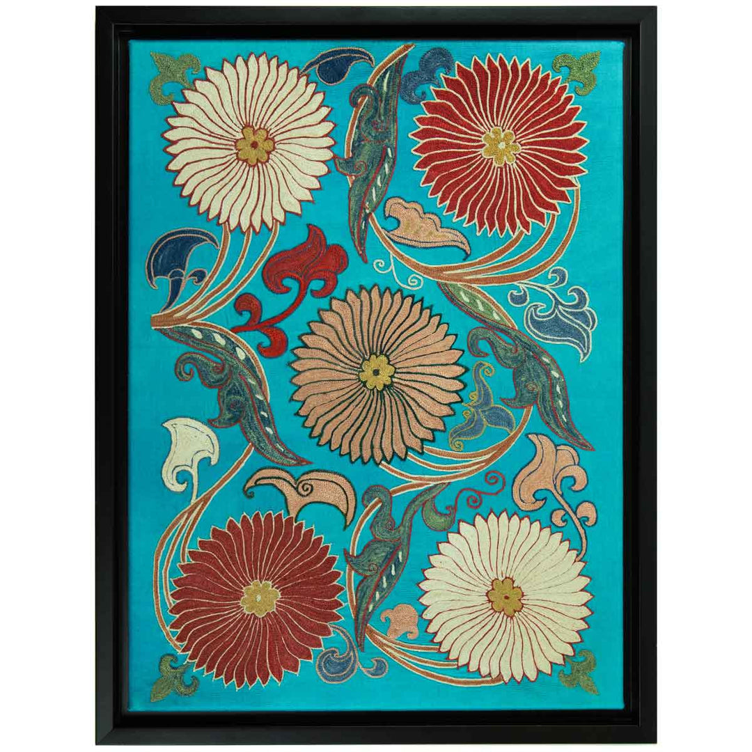 Front view of Mekhann's hand embroidered, turquoise silk artwork, showing five embroidered flowers with leaves in swirl shapes around the flowers. All of these details are brought together with a black frame.