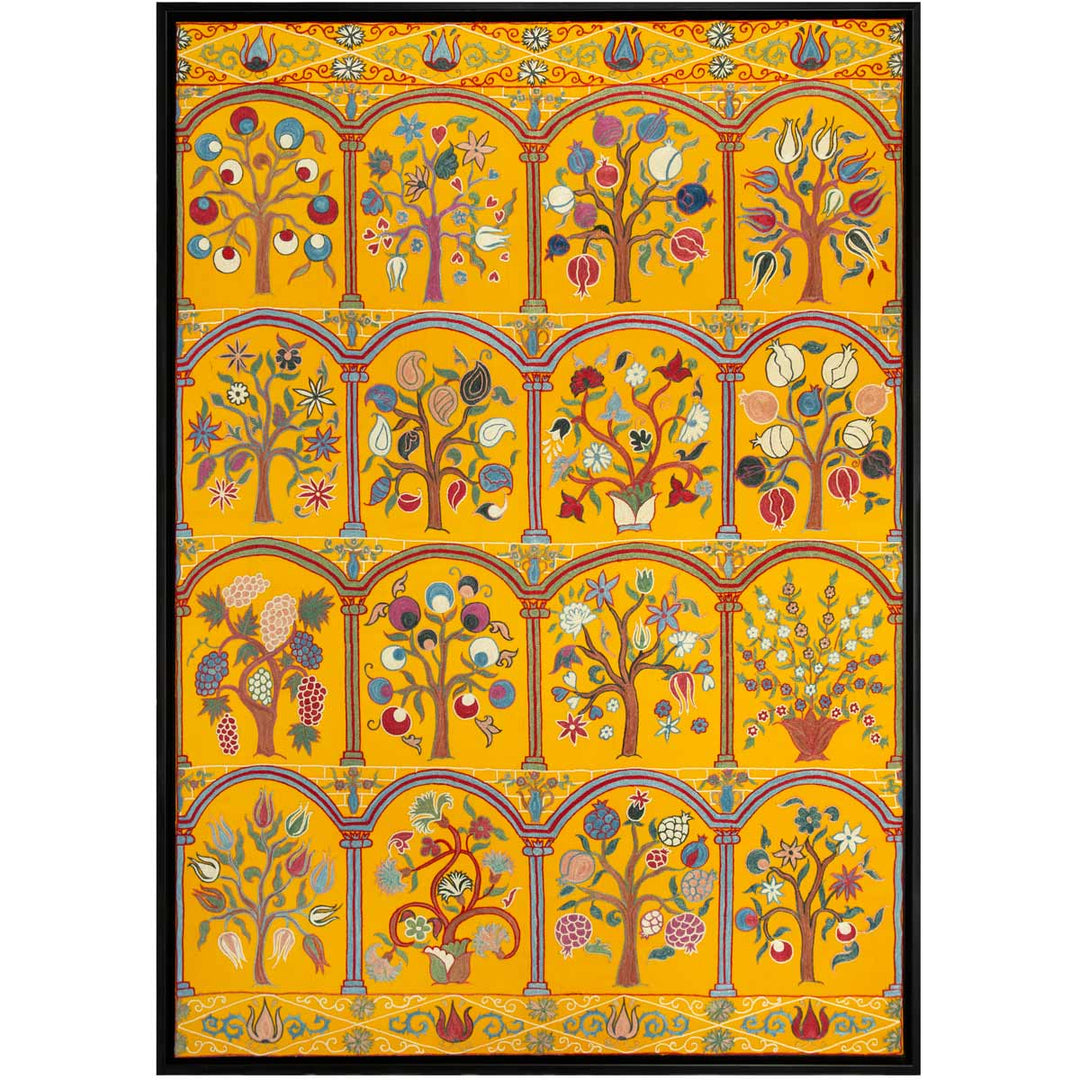 Front view of Mekhann's yellow silk garden artwork, showcasing a display of different tree, all embroidered with different items growing from the branches. With a black frame to encapsulate everything.