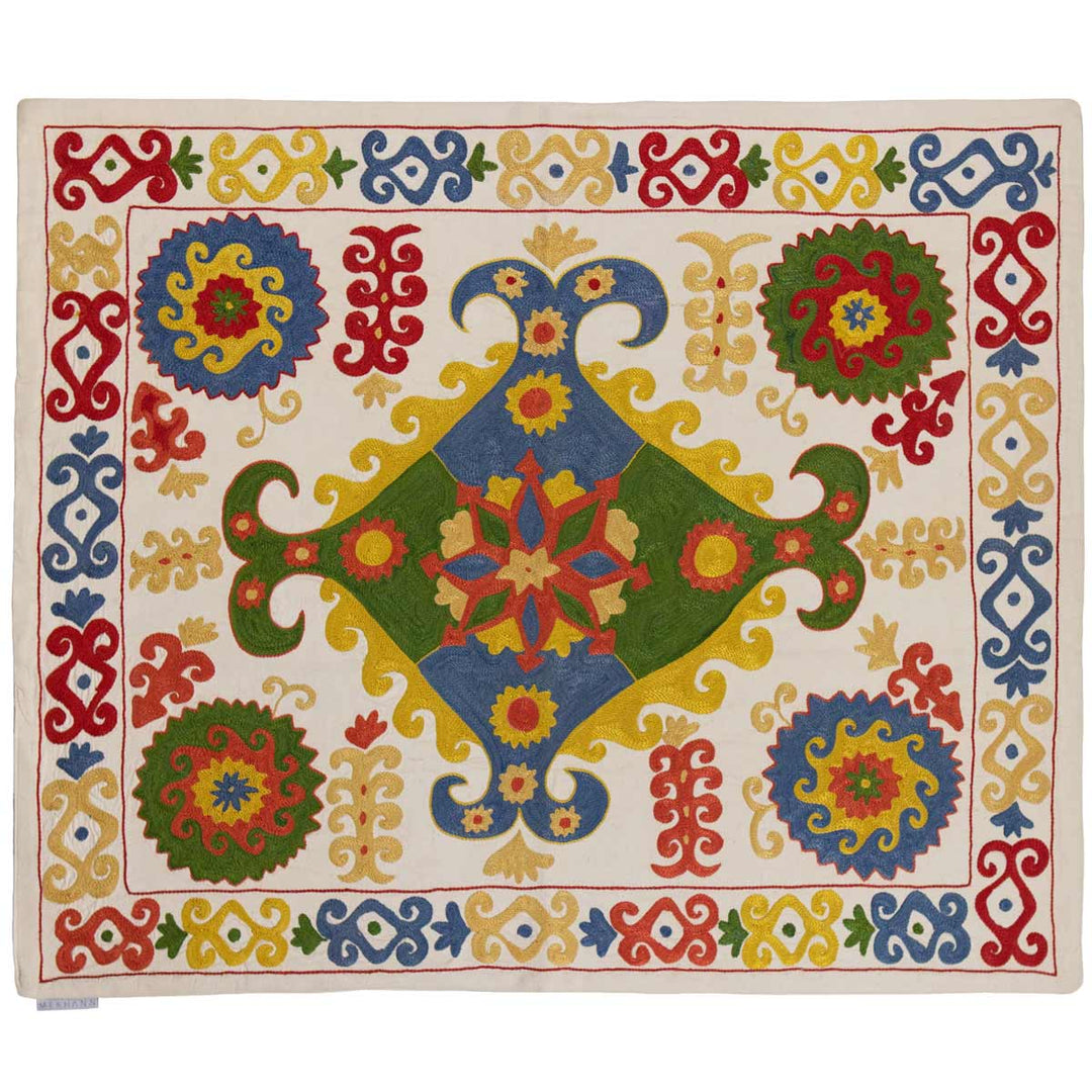 Horizontal view of Mekhann's multicoloured arabesque petite throw, showing an alternative placing on the throw.