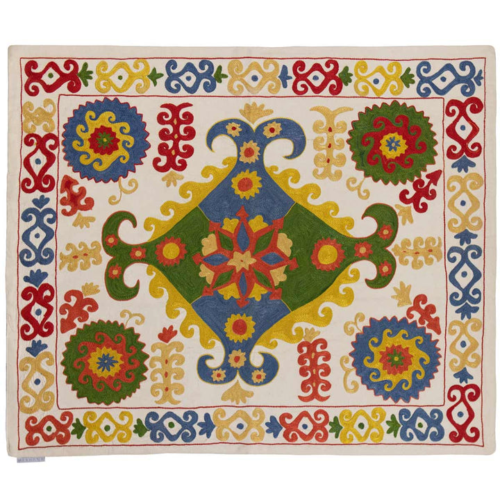 Horizontal view of Mekhann's multicoloured arabesque petite throw, showing an alternative placing on the throw.