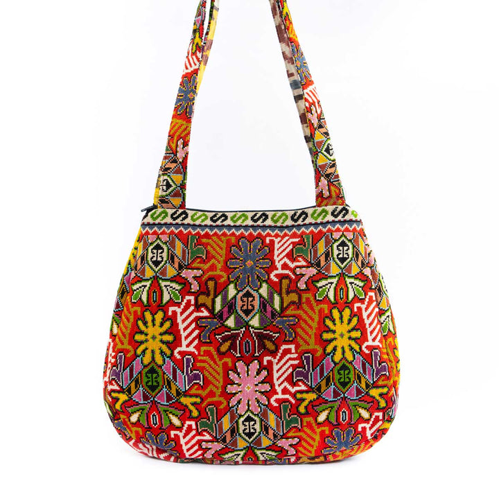 Front view of Mekhann's multicoloured embroidered shoulder bag, displaying a vibrant array of floral patterns and a versatile strap 