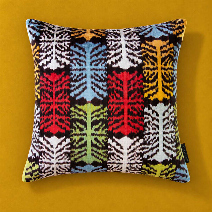 Front view of the Frond Cushion in Charcoal, with multicoloured branching motifs. 
