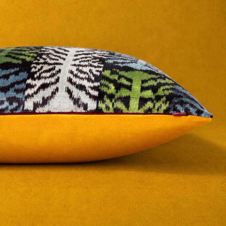 Side and zip detail of the Frond Cushion in Charcoal, showing the Saffron reverse. 
