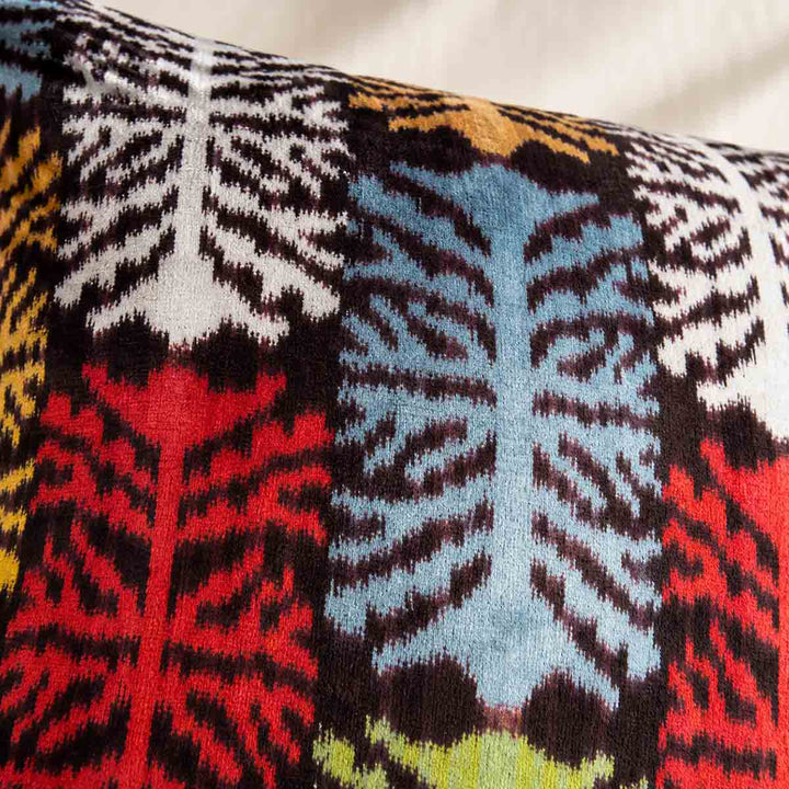 Close-up of the multicoloured branching pattern on the Charcoal Frond Cushion. 
