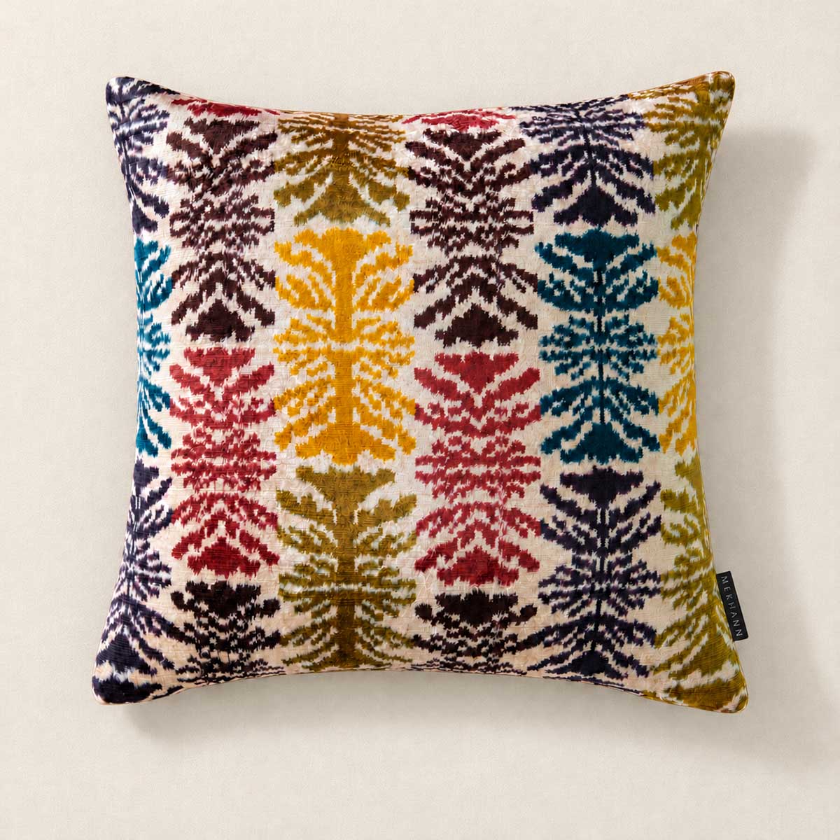 Front view of the Frond Cushion in Ivory, with multicoloured branching motifs. 