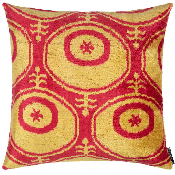Front view of Mekhann's orange moon velvet cushion, displaying a collection of moon shapes in a light orange, offset by a darker orange for contrast and definition.
