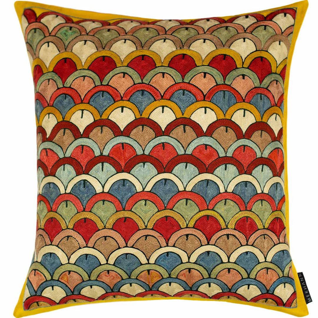 Front view of Mekhann's Yellow Domes silk fully embroidered cushion, with a repeating dome pattern in warm hues of reds, yellows and blues, representing the fusion of traditional motifs with a modern approach .