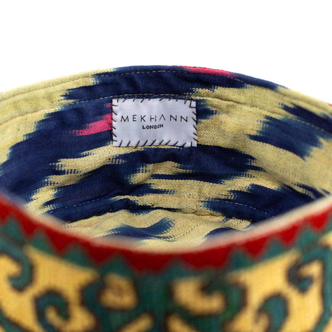 Inside view of Mekhann's geometric cream skull cap, Showcasing the soft ikat lining that is as comfortable as it is beautiful.