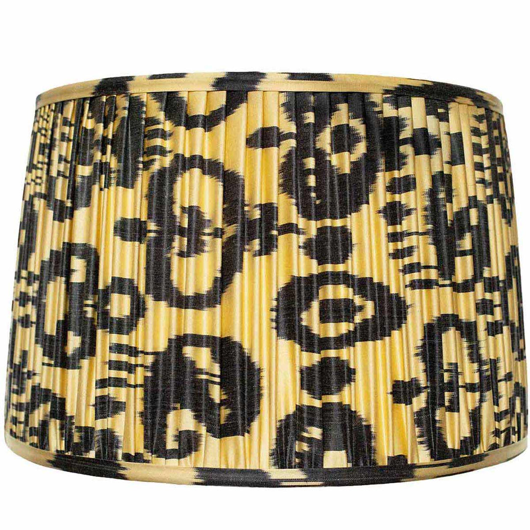Mekhann's large black on cream ikat silk lampshade, an elegant home decor piece, coloured with eco-friendly dyes for a sophisticated look.