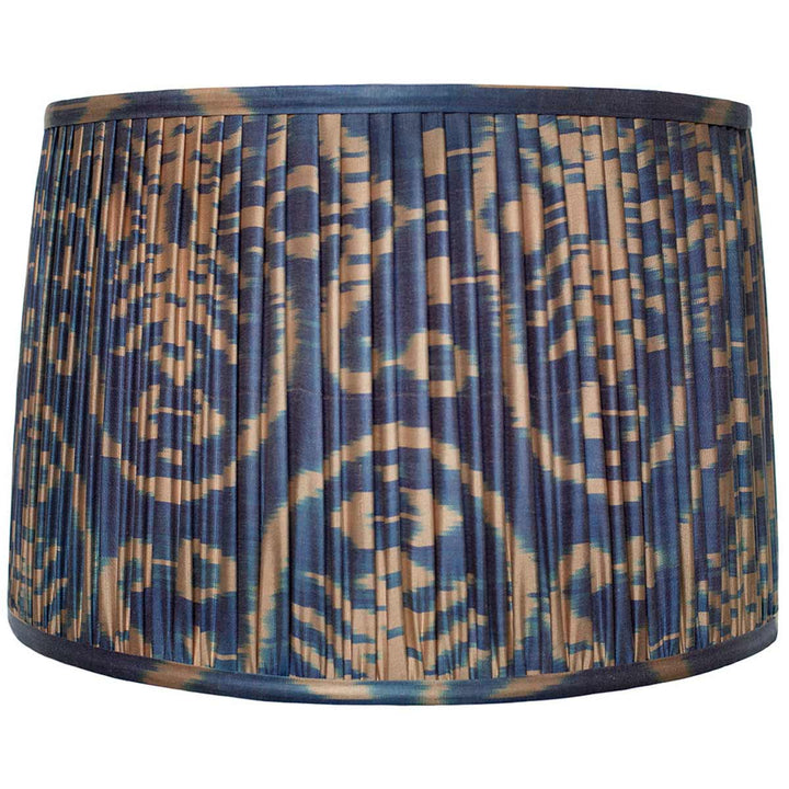 Large cream on navy ikat silk lampshade from Mekhann, a luxurious home accessory hand-pleated with sustainable dyes for a striking interior.