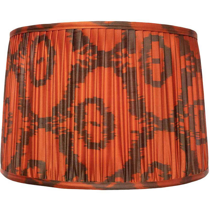 Mekhann's large orange ikat silk lampshade, a statement piece with bold patterns, dyed sustainably for a rich, warm glow.