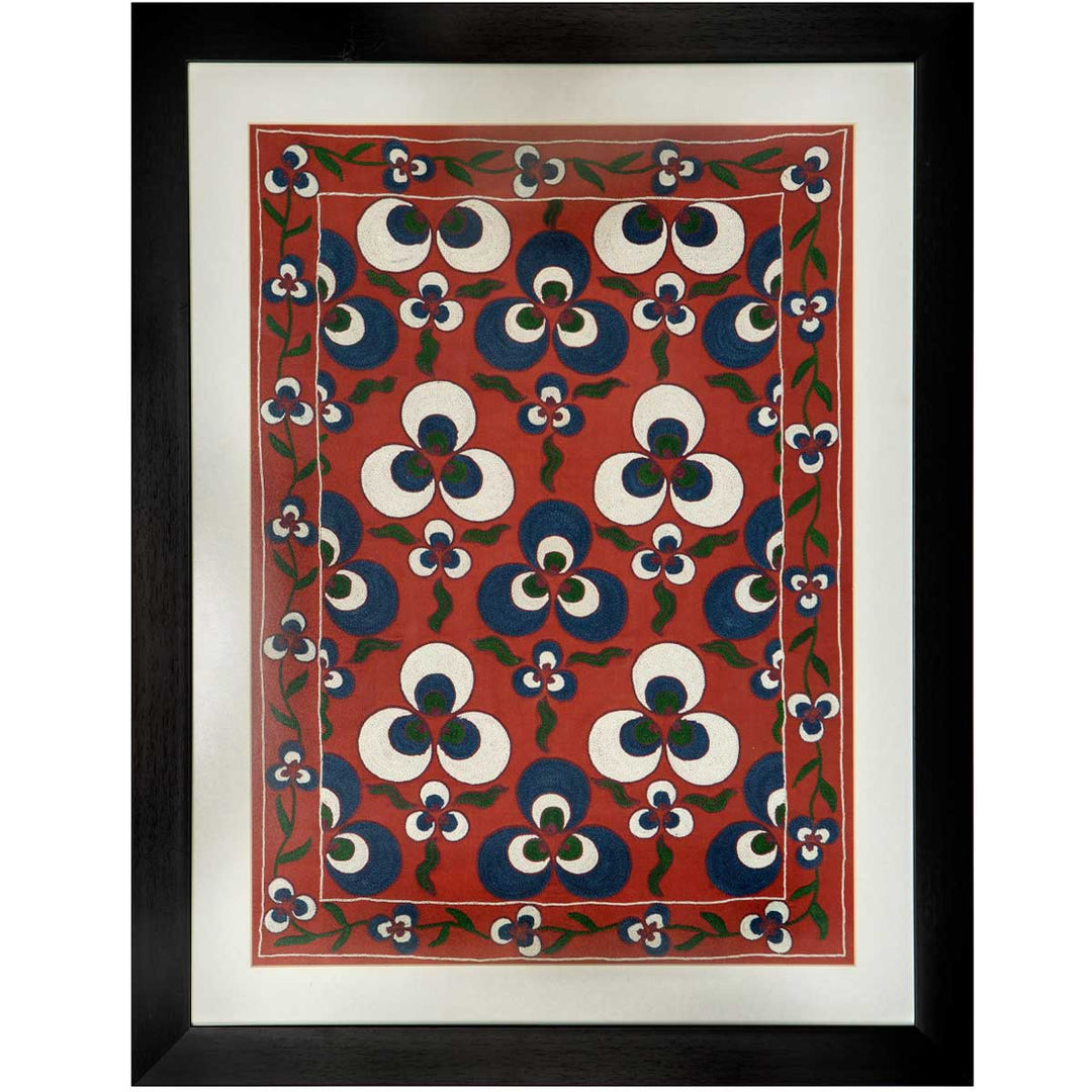Front view of Mekhann's maroon silk cintamani artwork, showing the cream and dark blue Cintamani embroidery. Finished off with a black frame with some white space between the silk artwork and the black frame.