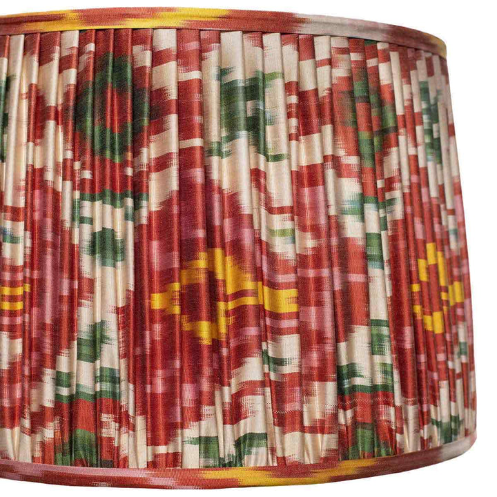 Close-up of the detailed multicolour ikat pattern on Mekhann's silk lampshade, emphasizing the artisanal dyeing and pleating techniques.