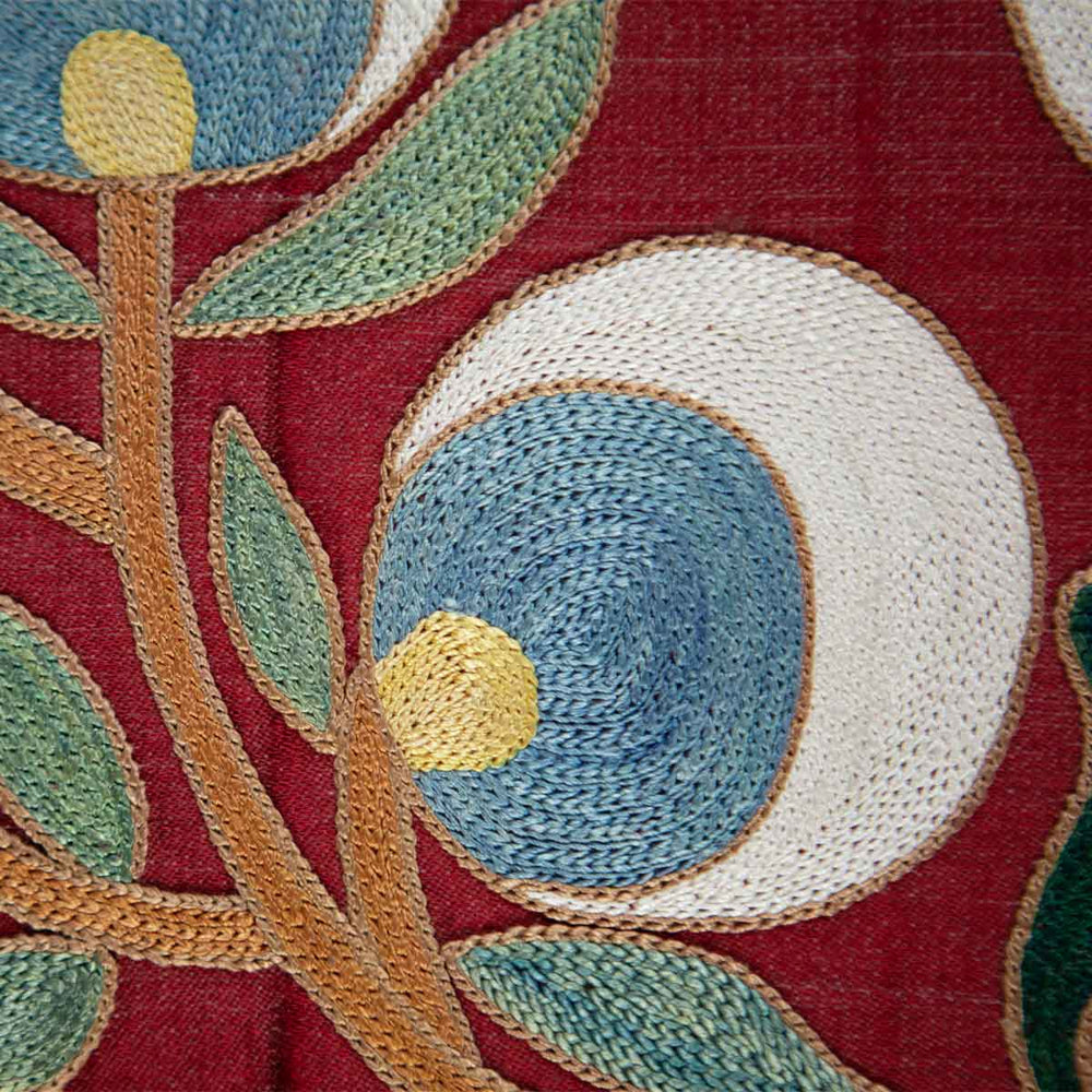 Close up view of Mekhann's maroon cintamani runner, showing all of the hand embroidered details on the cintamani patterns.