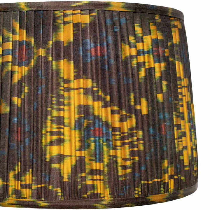 Close-up detail of Mekhann's silk ikat lampshade, with its kaleidoscope of colours and precise hand-pleating technique.