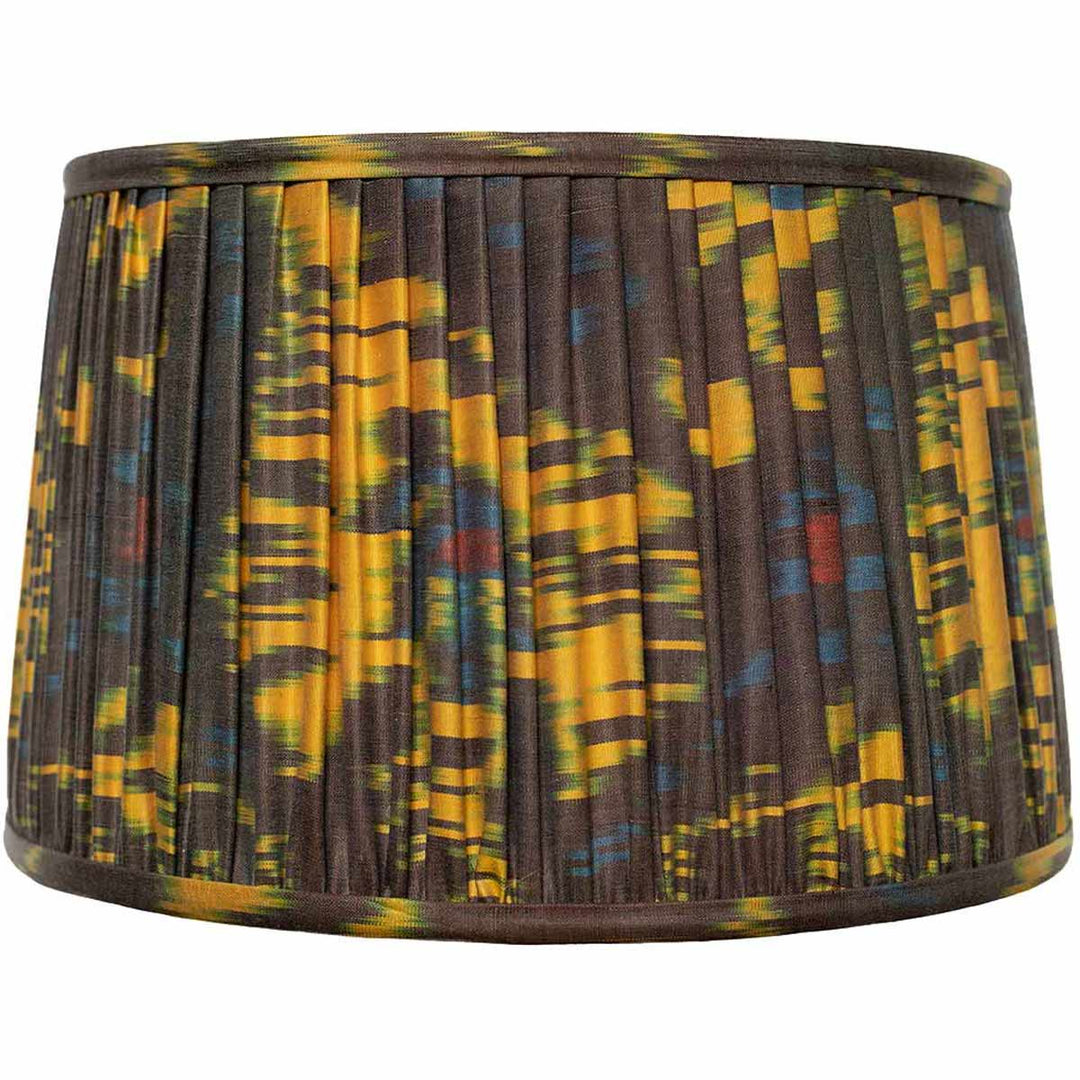 Front view of Mekhann's multicoloured silk ikat lampshade, featuring vibrant, eco-friendly dyes and hand-pleated craftsmanship.