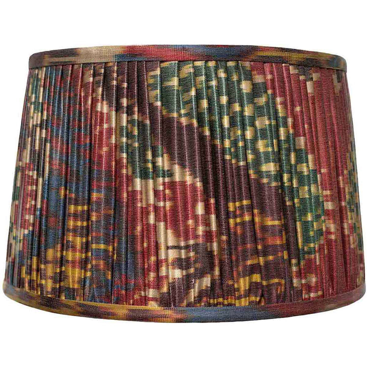 Front view of Mekhann's multicolour ikat silk lampshade, with a rich tapestry of hand-pleated design and natural dyes.
