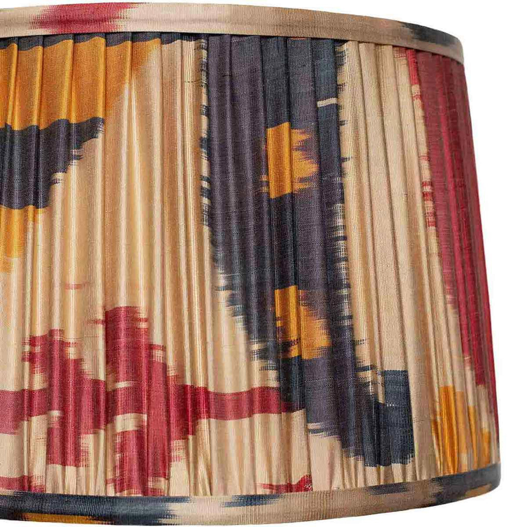 Close-up detail of Mekhann's ikat lampshade, highlighting the intricate patterns and rich, hand-applied colour